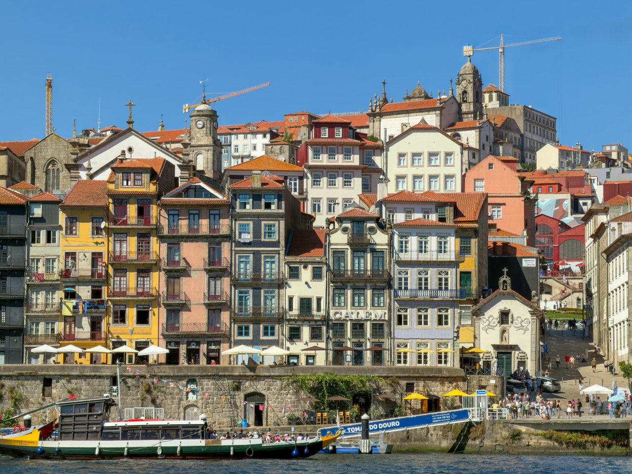 "Where the river slows, the city tells its story, etched in stone, painted in color, and warmed by the Portuguese sun."